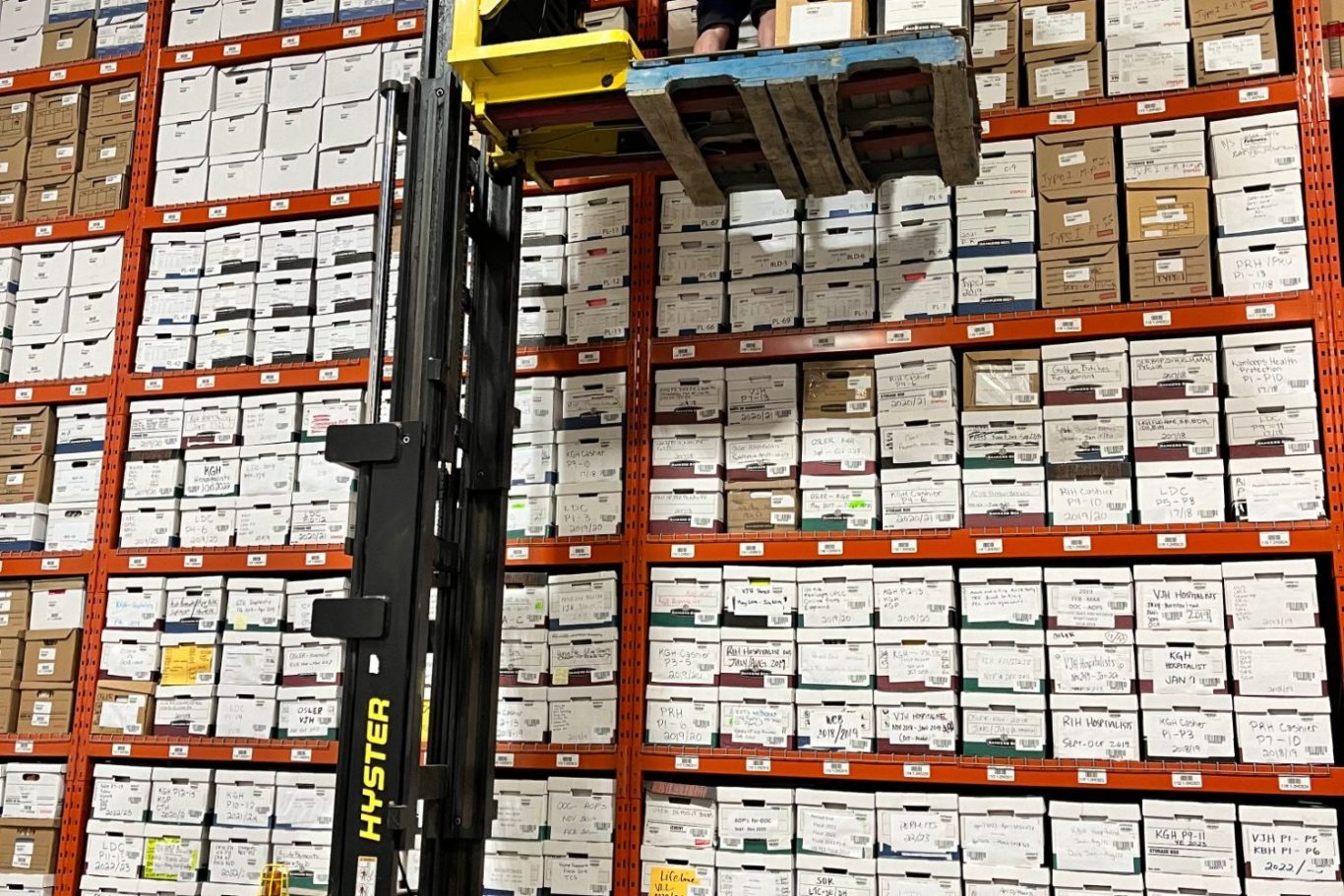 File storage boxes, organized, bar coded and stacked floor to ceiling for easy retrieval File box storage